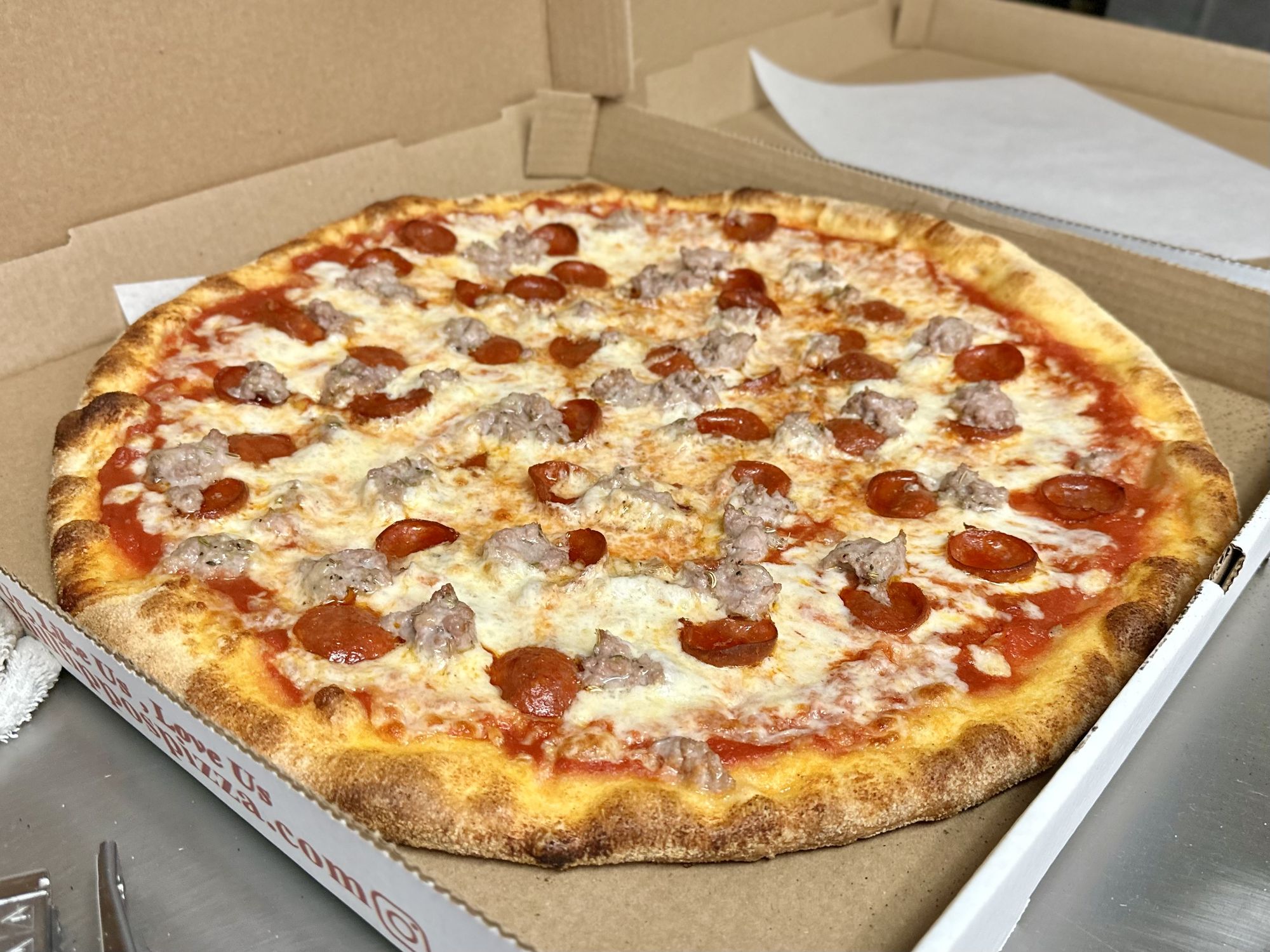 A fresh pepperoni and sausage pie from Phillippo's