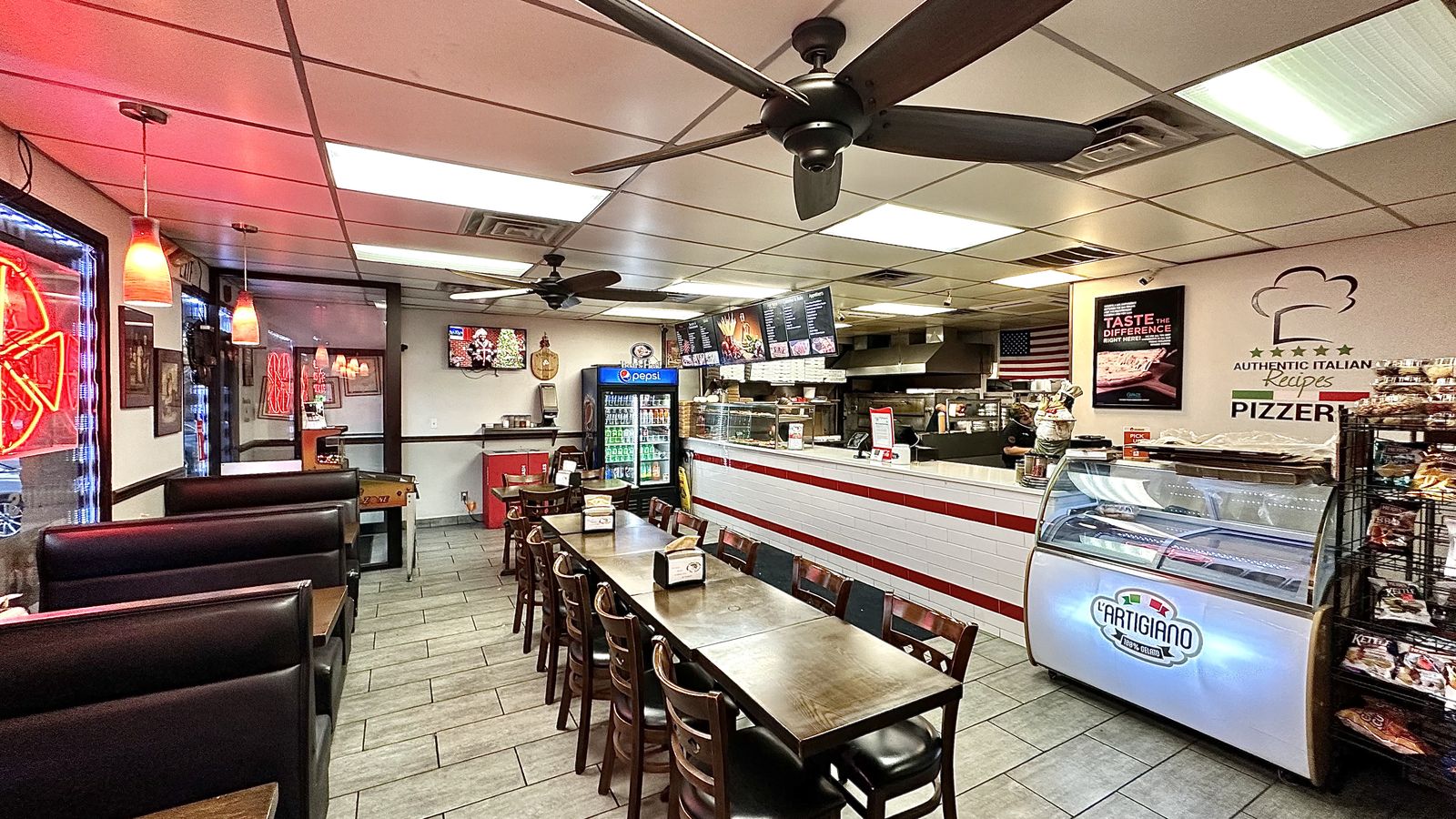 Inside the Phillippo's dining room with booths and counter